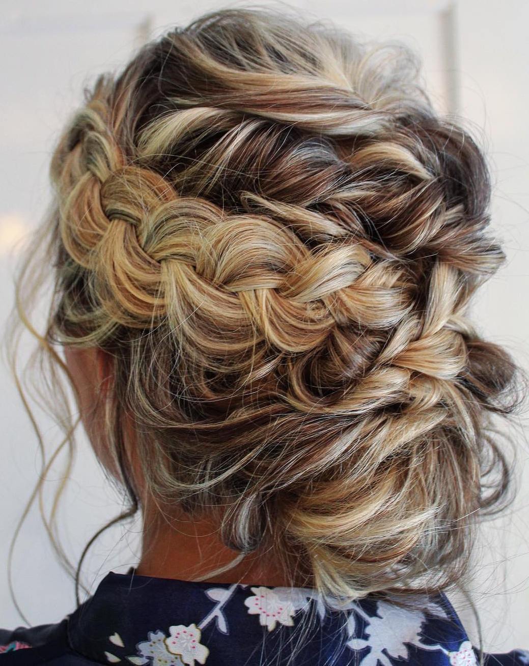Messy Low Bun Updo With A Braid And Twists